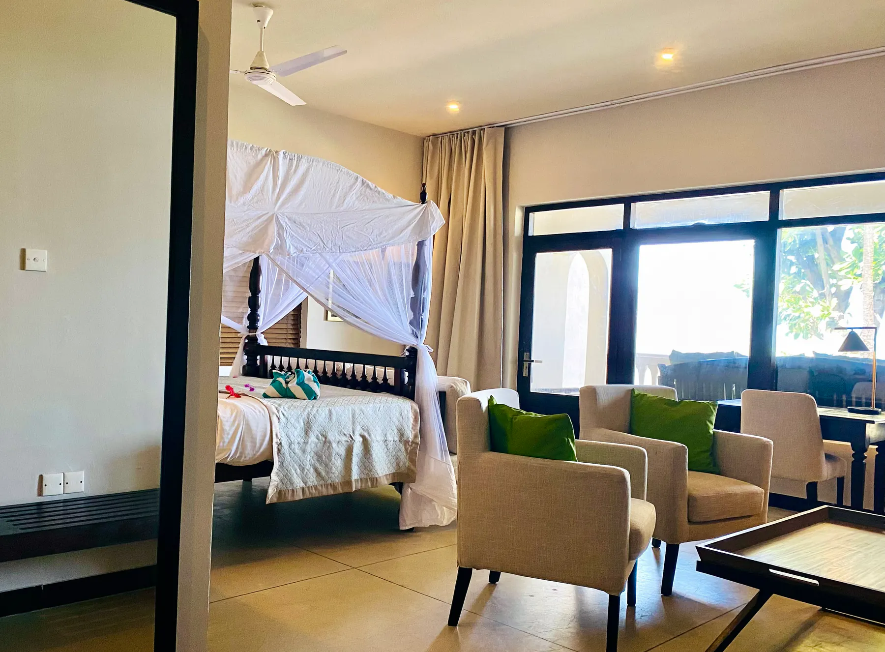 Wide view of the Deluxe Double bedroom and sitting area