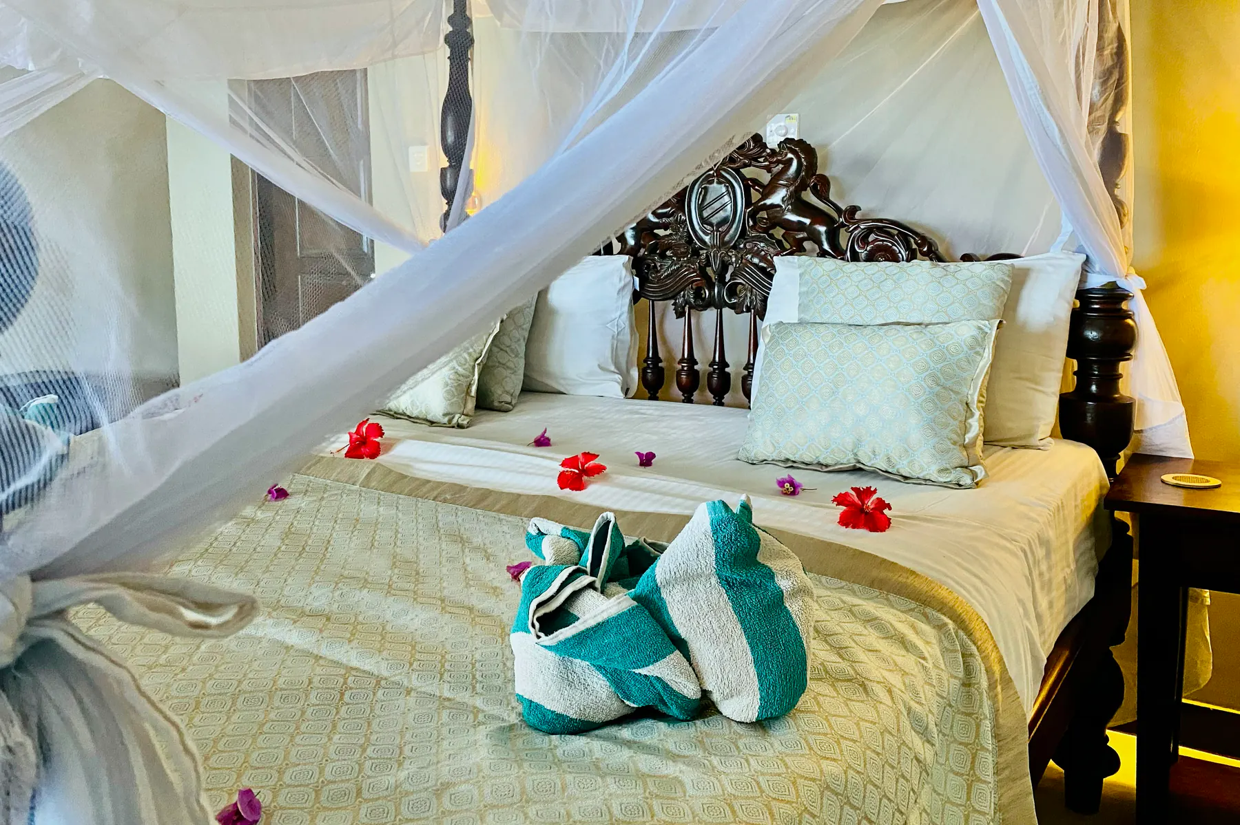 Deluxe Double four-poster bed prepared with floral details