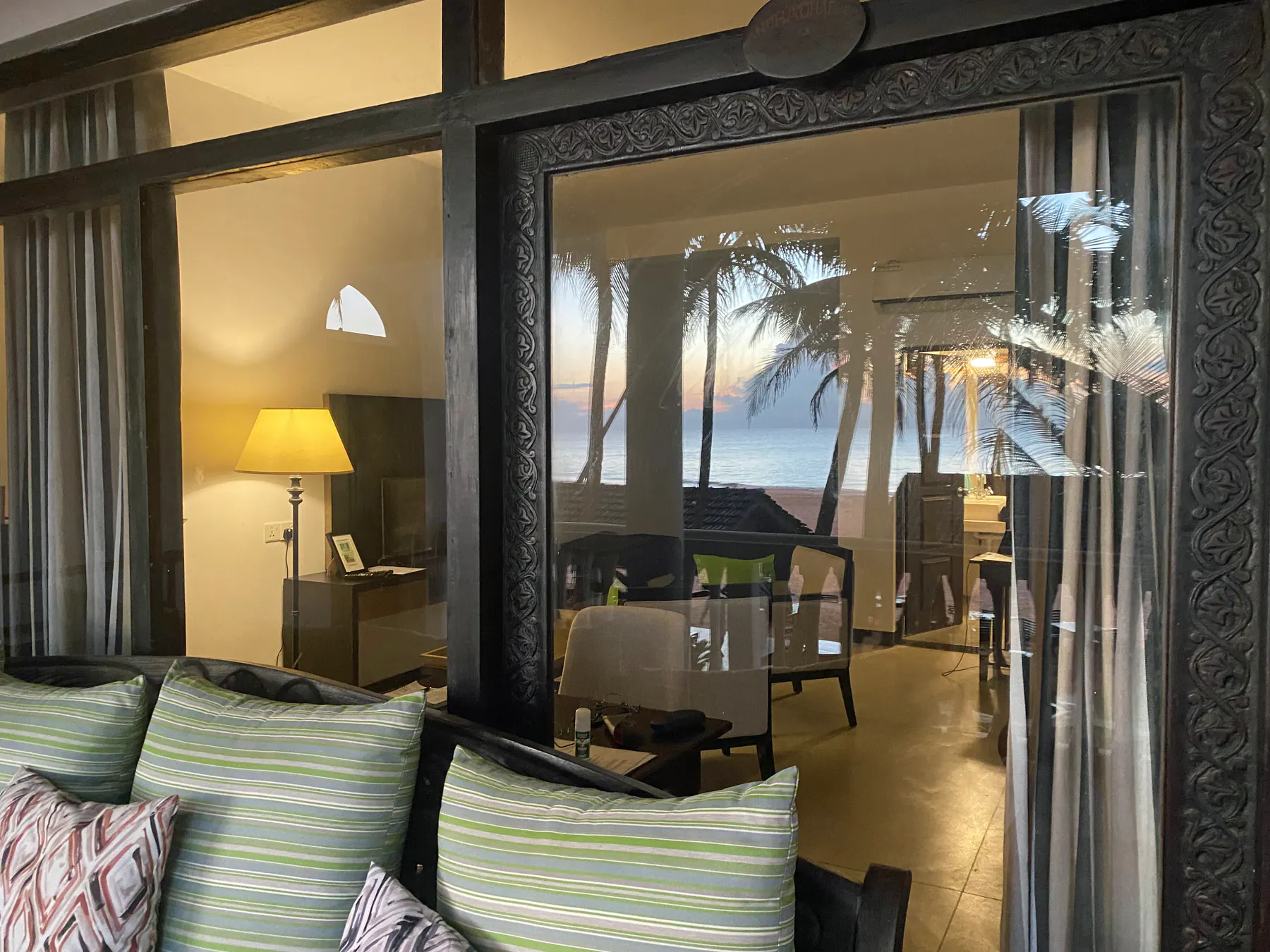 Sunset view through the Deluxe Double balcony doors
